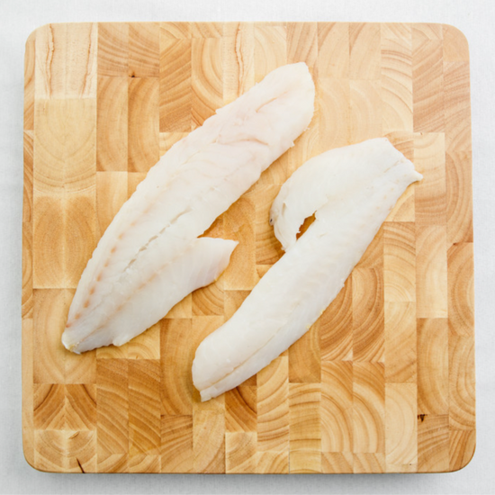 Raw fish on cutting board