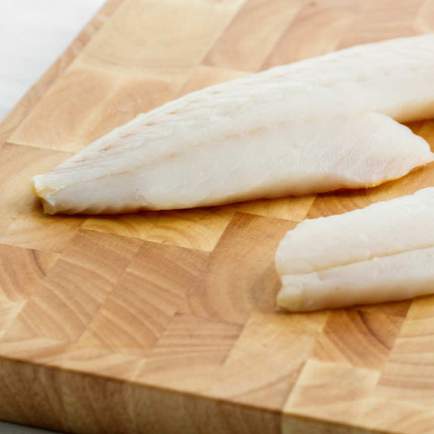 Raw fish on cutting board